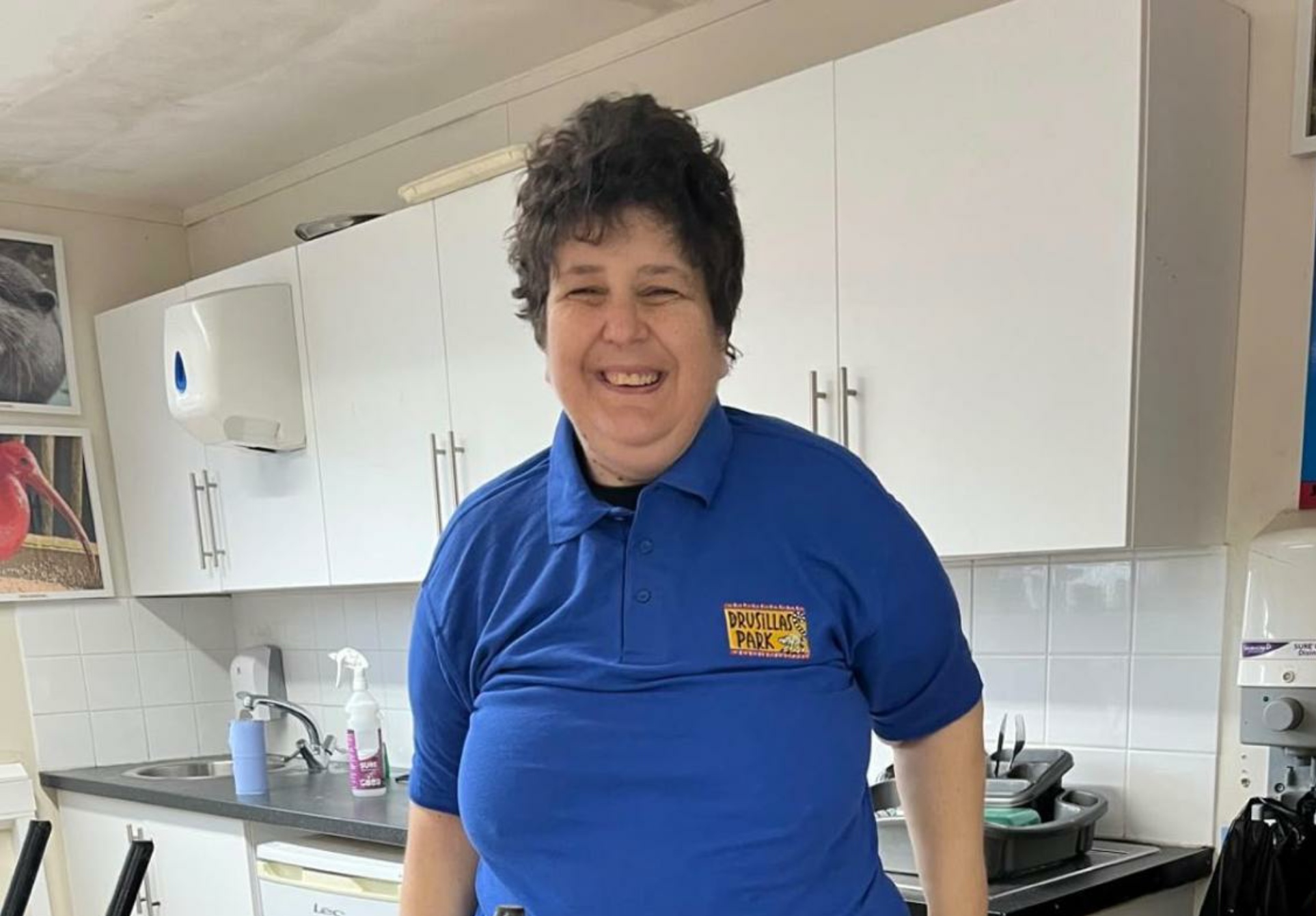 A resident in her Drusillas Park volunteer uniform at work