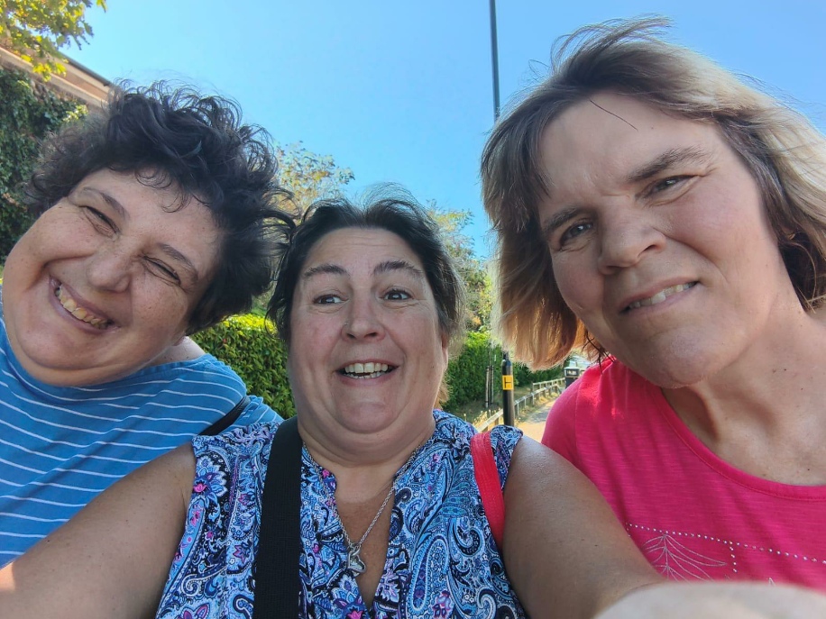 Residents and a carer out together in the community