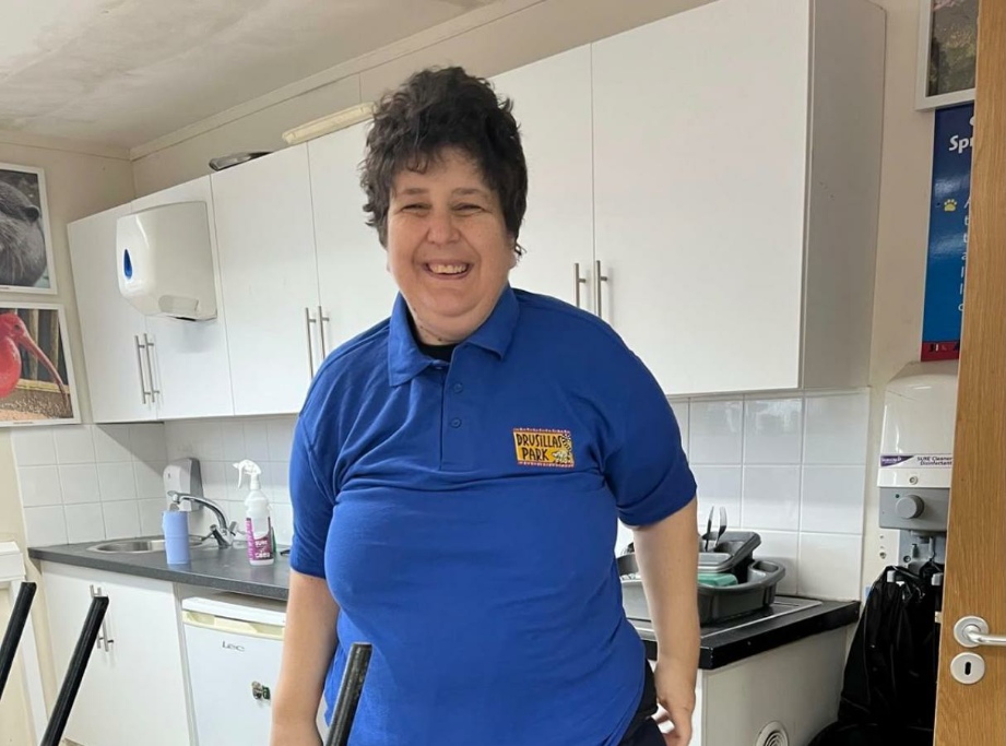 A resident in her volunteering uniform at Drusillas Park