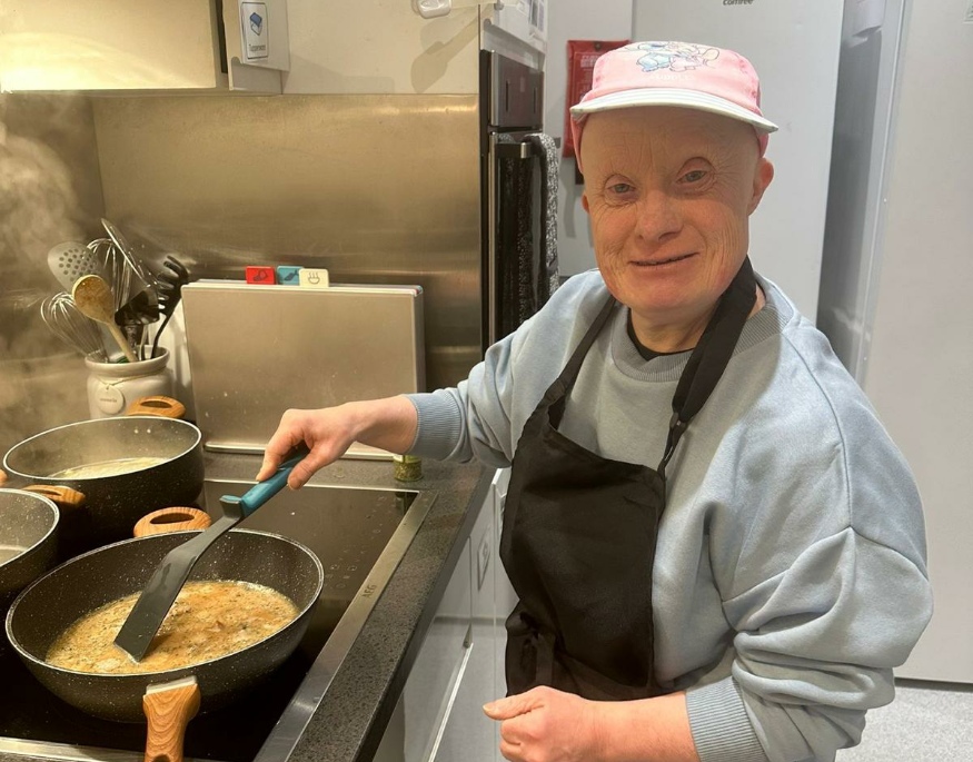 A resident cooking at Gow Lodge